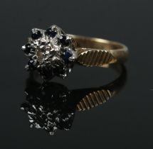 A 9ct gold sapphire and diamond floriform ring. Size I. 2.75g.