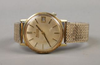 A men's yellow metal Bulova Accutron quartz wristwatch featuring baton markers and date display.