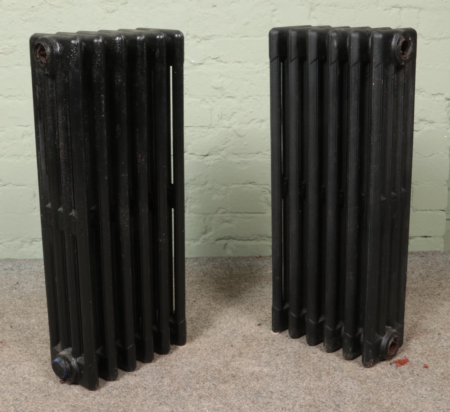 Two painted six-bar cast iron radiators. Height: 73cm.