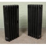 Two painted six-bar cast iron radiators. Height: 73cm.