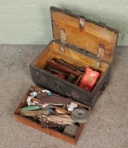 A vintage tool chest with contents of tools.