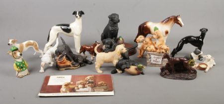 A collection of ceramic and composite figure groups, mainly depicting dogs. To include Leonardo,