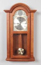 An Acctim Tempus Fugit pendulum wall clock featuring Westminster Chime.