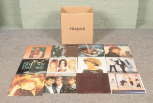 A box of assorted records, to include A-Ha, The Carpenters, 5 Star, Huey Lewis and The News, Kylie