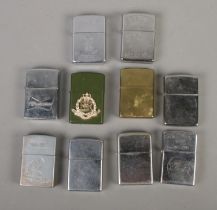 A collection of mostly Zippo lighters to include American Eagle, Beer Is Yummy, Budweiser,
