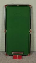 An Ambassador table top snooker table with score board and balls. 79x154cm