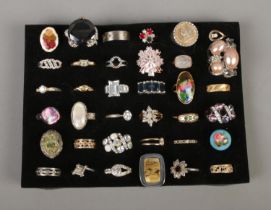 A collection of 36 costume jewellery dress rings to include titanium, mother of pearl and floral