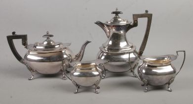 A Walker and Hall four piece silver plated tea sevice; contains teapot, coffee pot, milk jug and
