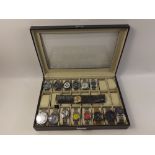 A quality display case for 28 watches to include contents of gents watches comprising WWOOR,