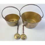 A brass jam pan 28cm diameter plus a smaller one approx 21cm as well as 2 decorative warming pans