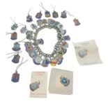 A silver charm bracelet loaded with enamelled charms from cities mainly Scottish, gross weight