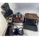 A collection of VINTAGE cameras to include a CAMPRO Home Cine Camera within its original box, also