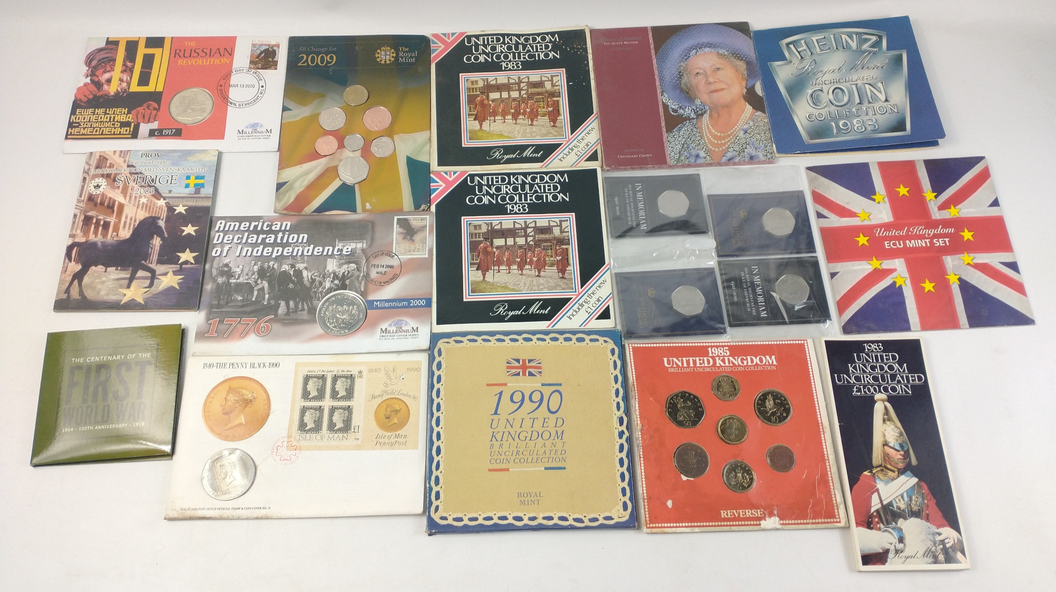 A collection of coins and coin sets on cards to include 1971 Russian Revolution 1 Crown Cover,