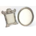 Two silver hallmarked photo frames the first Birmingham 1903 is an ornate frame with some age