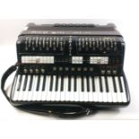 Black coloured electronic accordion Victoria "Duo Artiste" with various instrument settings, mike