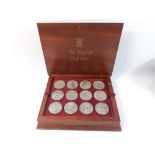 A ROYAL MINT set of The English Civil War coins presented in a wooden display box