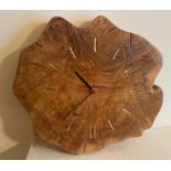 A hand carved wall clock (probably elm wood) - dimension 28cm approx