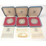 Three 1977 Silver Crown coins in cases with coa to include FALKLAND ISLANDS Fifty Pence and two