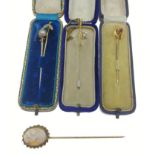 Seven stick pins, 2 with 9ct marks gross weight 1.43g , and the other 5 yellow metal