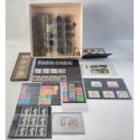 A mixed lot of coins and stamps to include 12 sets of 1953 UK coins, a mis-struck 1860 penny, a