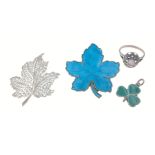 A small silver lot comprising 2 Canadian maple leaf brooches, one Danish silver blue enamel, the