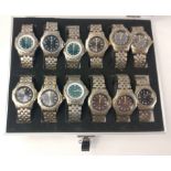 An aluminium style display case with twelve ACCURIST branded perpetuals watches, some used
