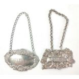 Two silver hallmarked decanter labels with unmarked chains, the first for brandy is marked London