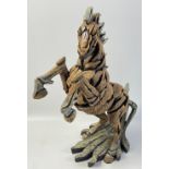 An EDGE rearing horse sculpture by MATT BUCKLEY hand-crafted in stone resin, stands 33cm tall, no