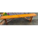 An ANTIQUE folding wooden bench with Wm Leith Hirer Berwick painted on the underside - dimensions