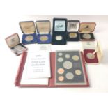 Mixed boxed coins of interest lot to include 1996 proof year set in case with coa, 1978 Isle of