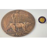 A WWI death penny/plaque awarded in memory of Adam Anderson KSOB of Greenlaw who died in 1915