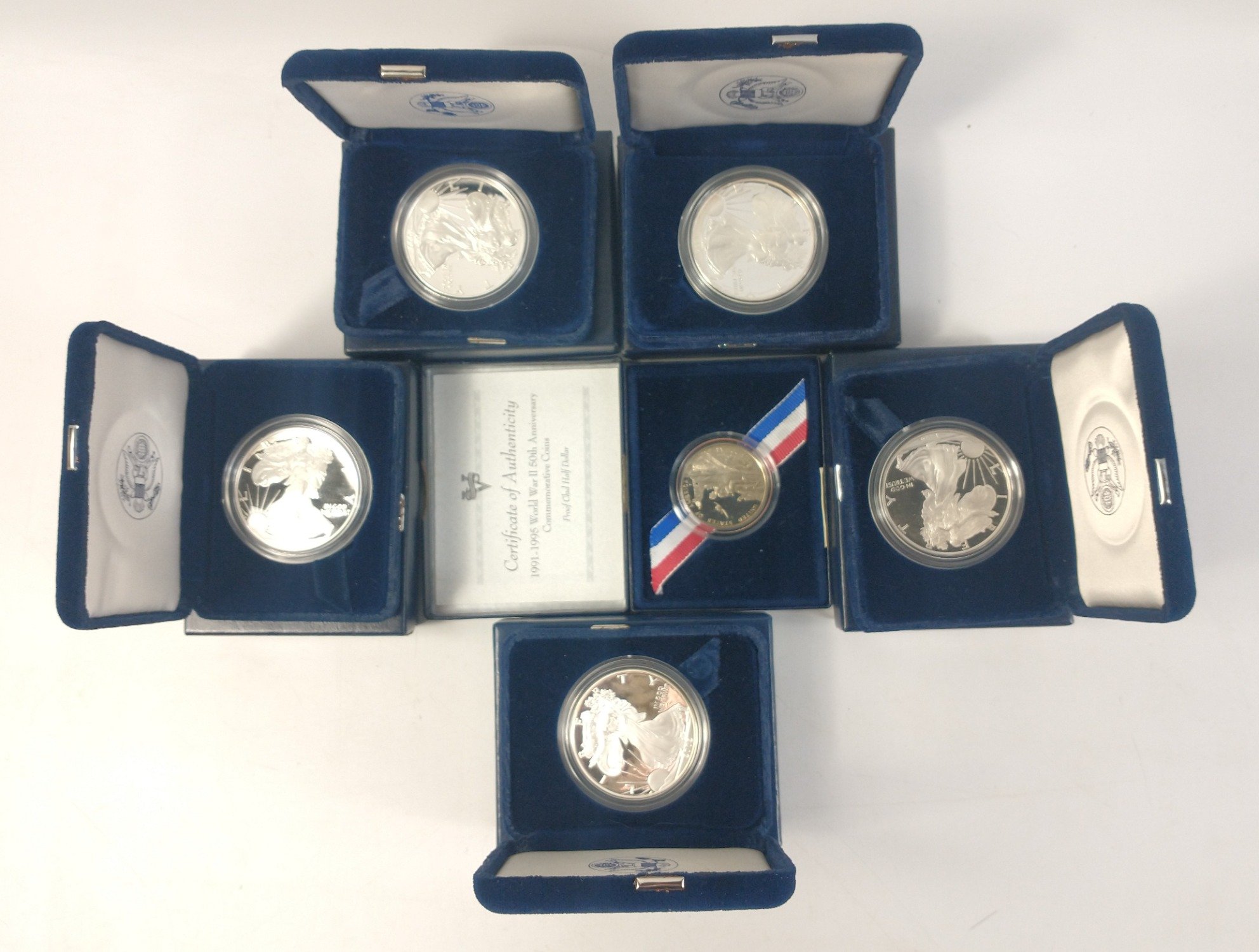 Five AMERICAN ONE OUNCE SILVER PROOF EAGLES in boxes with plush cases and paperwork 1994, 1995,