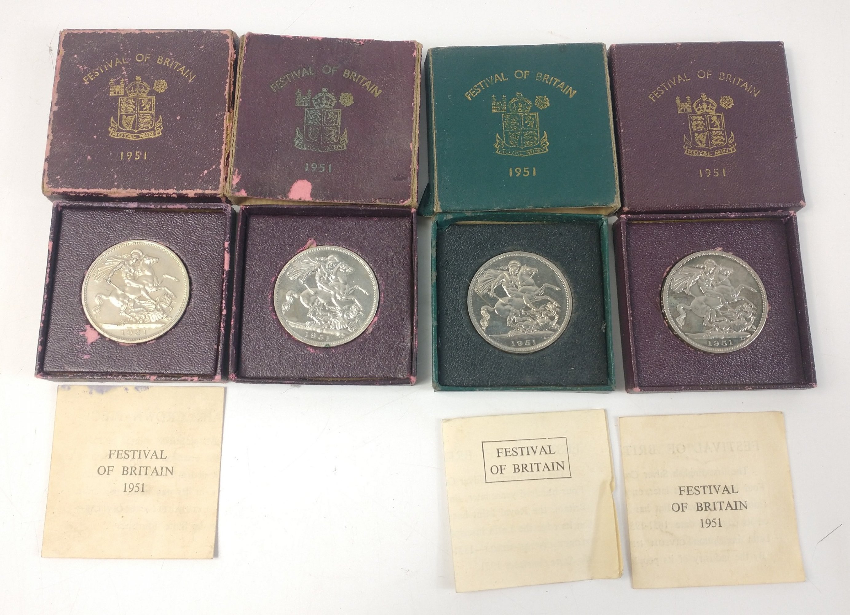 Four boxed 1951 FESTIVAL OF BRITAIN Crowns in boxes three with coa, all four coins excellent but