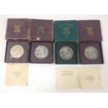 Four boxed 1951 FESTIVAL OF BRITAIN Crowns in boxes three with coa, all four coins excellent but