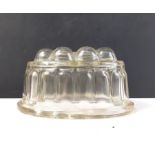 WOBBLE! An EDWARDIAN pressed glass jelly mould - dimensions 17cm x 11cm x 10cm approx