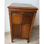 A nice ERCOL inspired two door dark oak effect music score sheet or map cabinet - dimensions 2.5ft