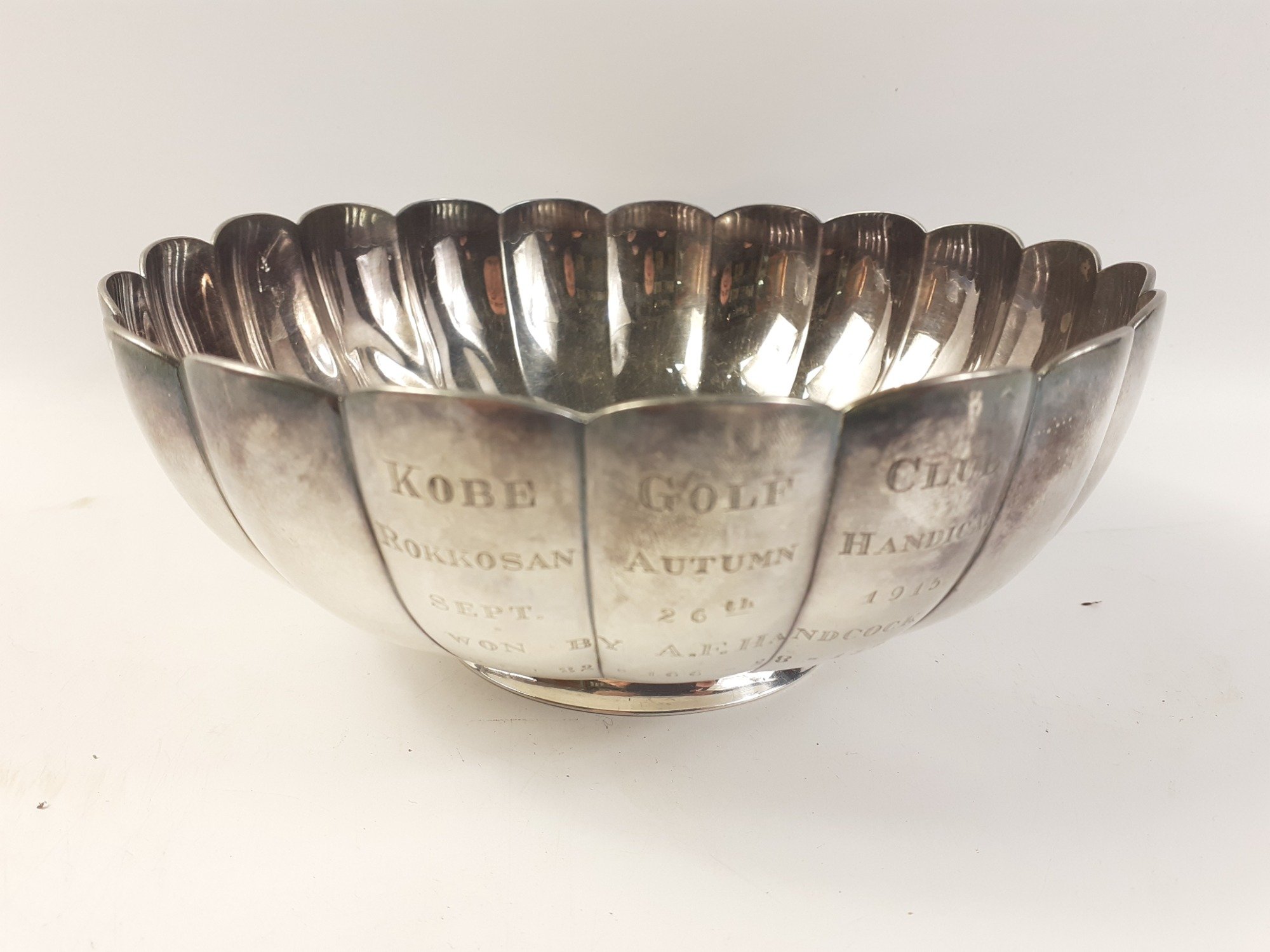 First of its kind! (Japan)A white metal trophy with scalloped edges (17cm diameter), presented