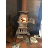 A VINTAGE cast iron pot-belly inspired wood-burner with flue - dimensions of burner only 65cm tall