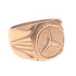 A substantial signet ring stamped 18K 750 with Mercedes car logo, size W weight 18.42g approx