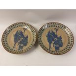 A pair of antique Chinese printed blue glazed ceramic plates