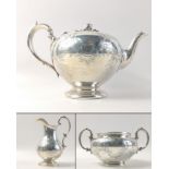 A stunning Victorian solid silver teapot, cream jug and sugar bowl