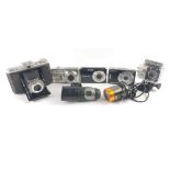 An OREGON SCIENTIFIC E-AT18G digital camera, a FINIPIX F70EXR camera, a CASIO EXILIM camera, a