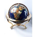 SUPER QUALITY!A LARGE blue based globe with stone inlay on a brass stand