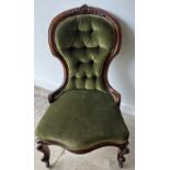 A LOVELY EXAMPLE VICTORIAN deep buttoned nursing chair in mahogany with green velvet upholstery
