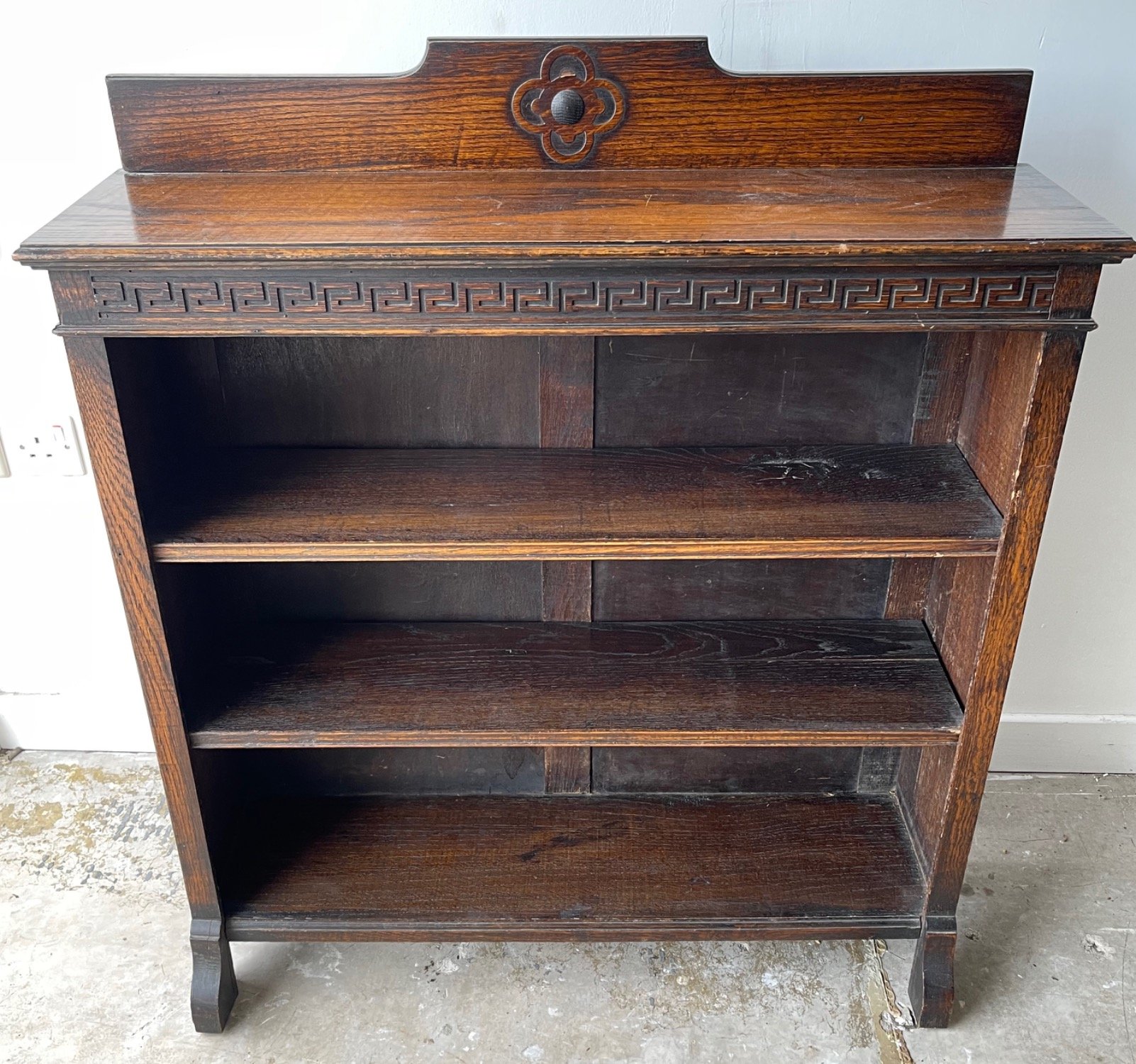 A nice circa 1930's 3 shelf floor bookcase in dark oak with an UNUSUAL MOTIF DESIGN - dimensions