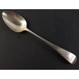 A single Georgian solid silver dessert spoon with indistinct marks but appears to be Newcastle