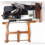 A selection of hand tools including a 3/8 torque wrench, an old-fashioned saw and 5 planes