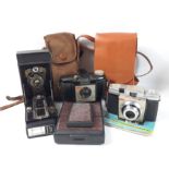 A collection of vintage cameras to include A KODAK Brownie 127, a KODAK ColorSnap 35, a POLAROID