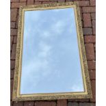 A large gilt framed rectangular wall mirror - dimensions 2ft width x 3ft height approx