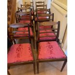 A set of 10 dining chairs - two of which are carvers - all finished in a quality red fabric